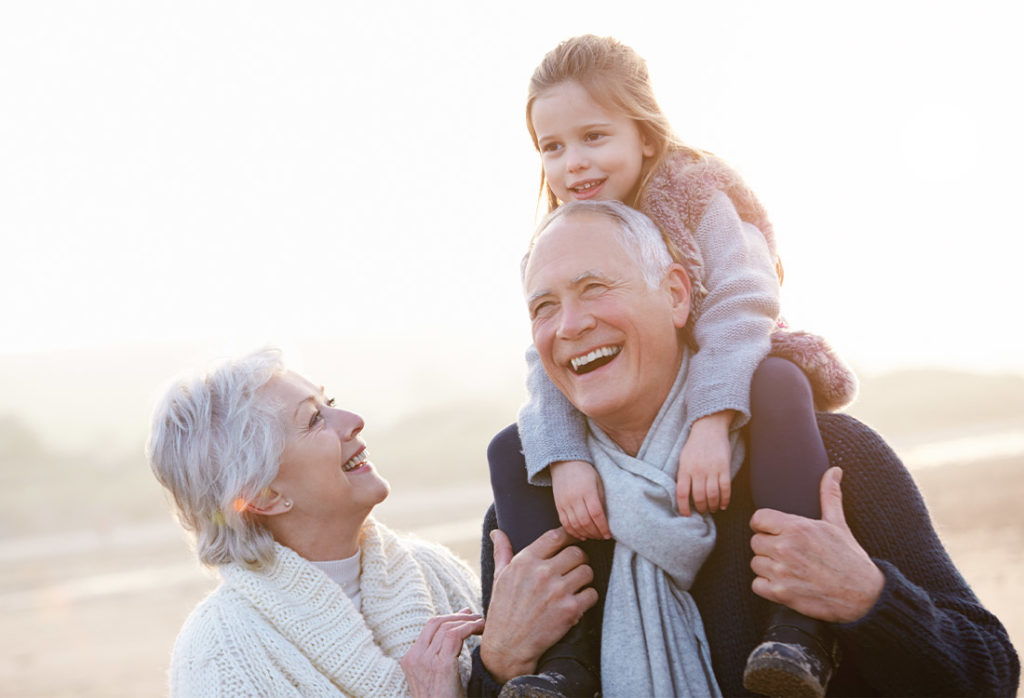 happy grandparents with their granddaughter at the beach are annuities safe