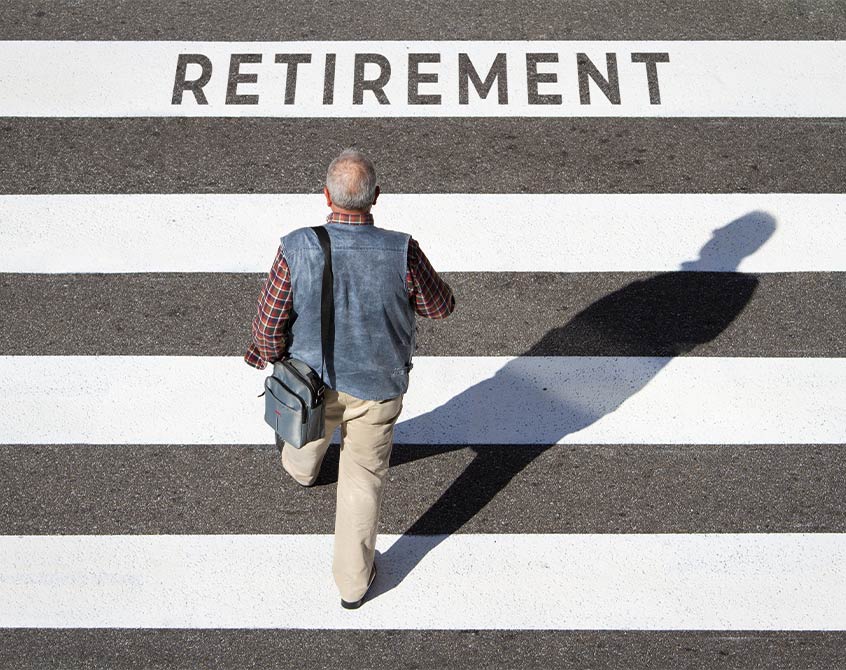 man in crosswalk with the word retirement in the pavement federal employees retirement system